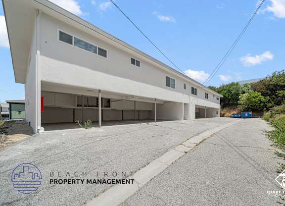 the beach front property management office is located on the side of the building