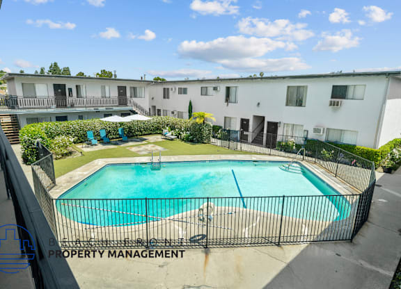 a view of a swimming pool in front of a building