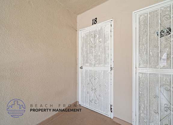 A white door with a glass window is closed.