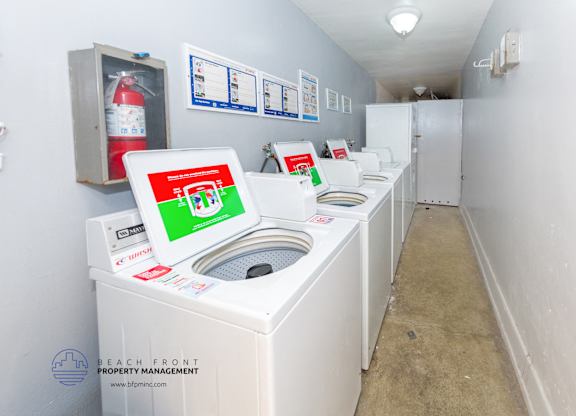 A laundry room with a washing machine and a dryer.
