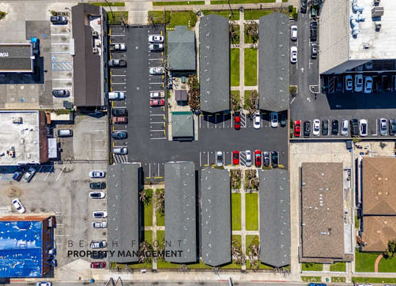 a birds eye view of a parking lot with cars on it