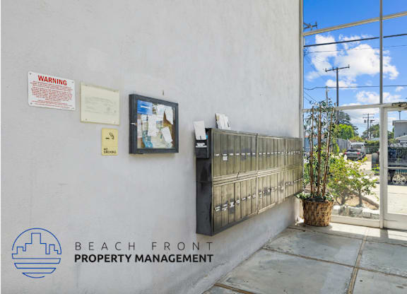the entrance to the beach front property management office at the front of the building