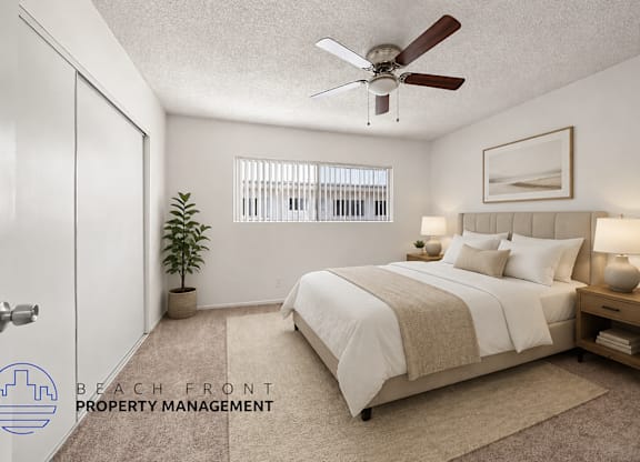 A bedroom with a bed, a ceiling fan, and a plant.