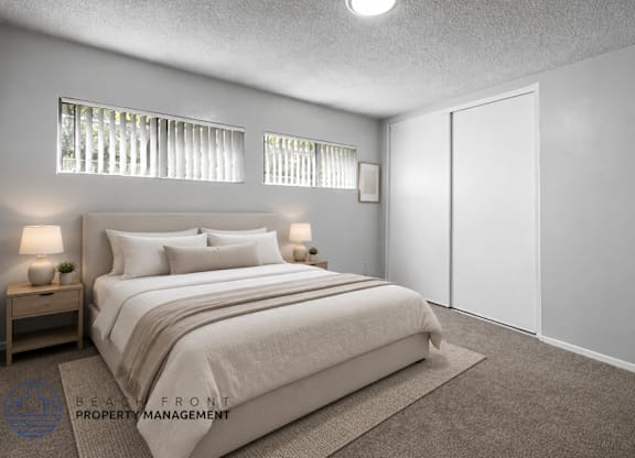 A bedroom with a large bed, two nightstands, and a carpeted floor.