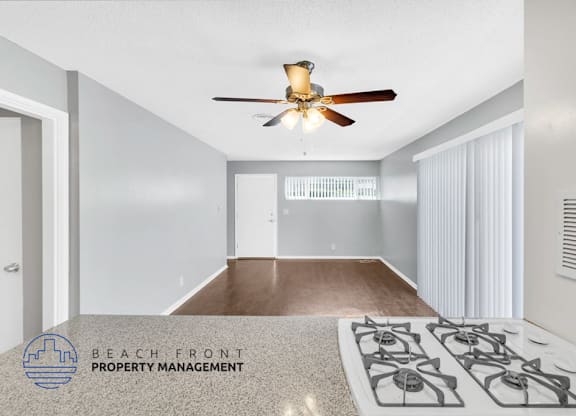 A white doorway leads to a small, empty room with a checkered floor.