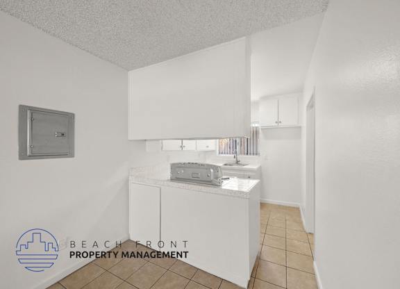 A small white bathroom with a sink and a toilet.