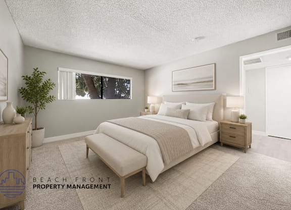 A well-lit bedroom with a large bed and a window.