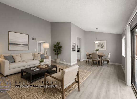 A living room with a couch, coffee table, and chairs.