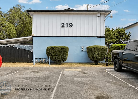 A white building with the number 219 on it.