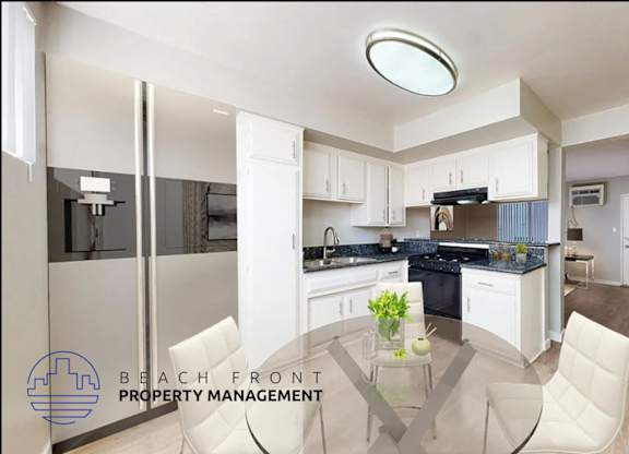 A modern kitchen with a dining table and chairs.