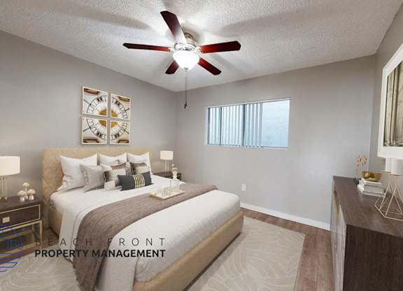 A bedroom with a bed, nightstand, and a ceiling fan.