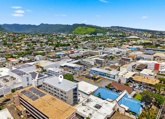 A cityscape with buildings and a clear sky.
