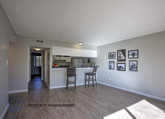 A kitchen area with a dining table and chairs.