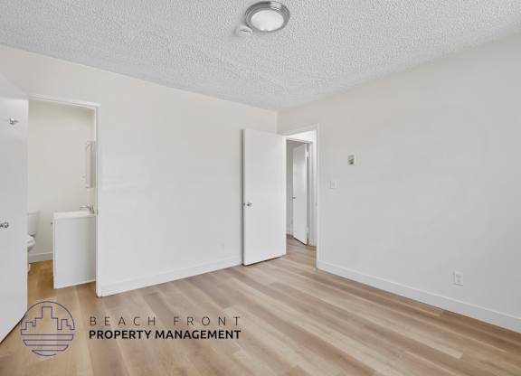 A room with a logo of Beach Front Property Management.