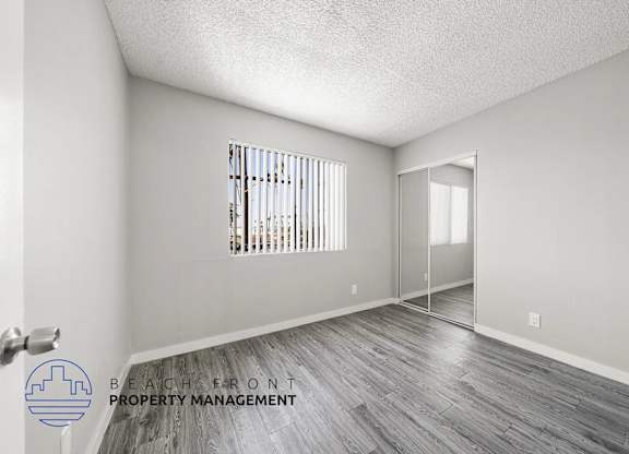 A room with a window and a door is shown in the image.