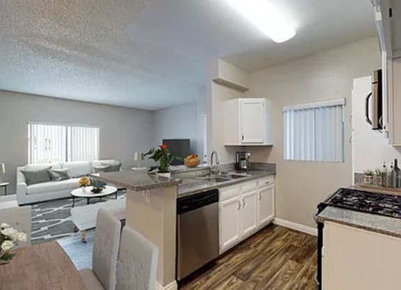 A kitchen with a stove top oven and a dining table.