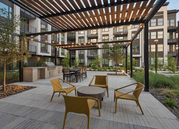 a rendering of an outdoor patio with tables and chairs