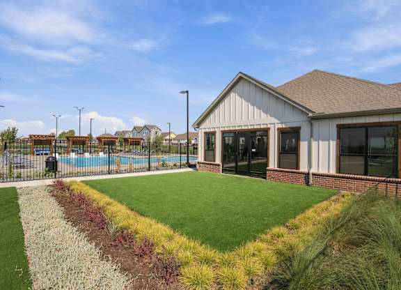 A house with a pool in the backyard.