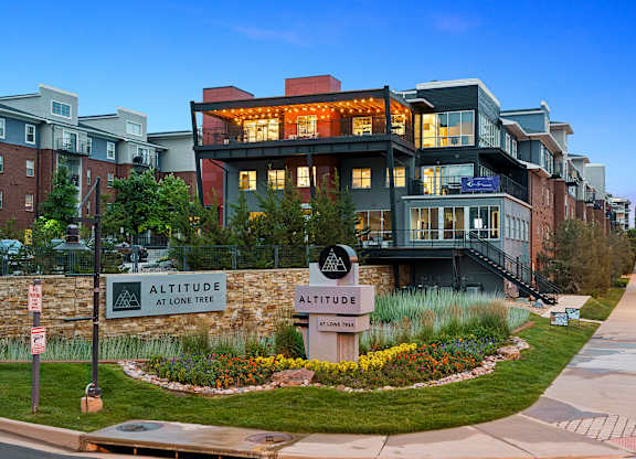 A modern building with a sign that says Altitude at Lone Tree.