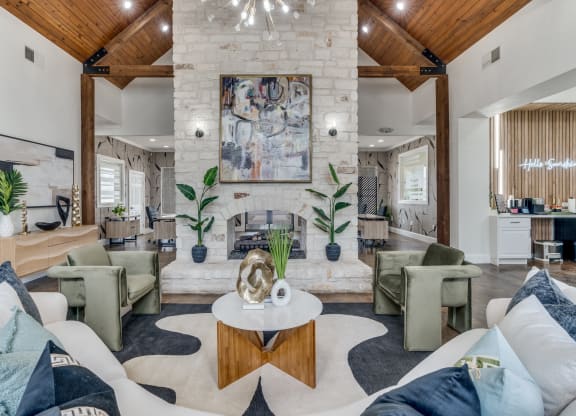 a living room with couches and chairs and a fireplace