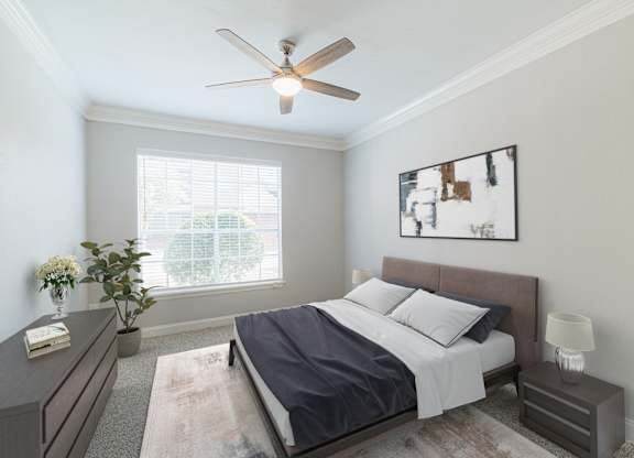 a bedroom with a bed and a ceiling fan