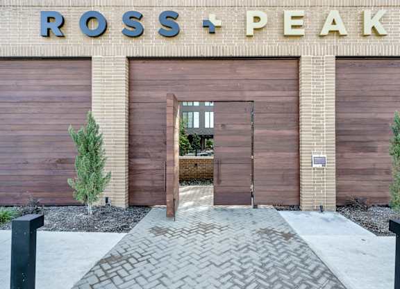 A building with a sign that says Ross + Peak.
