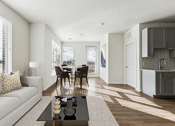 A modern living room with a white couch and a coffee table.