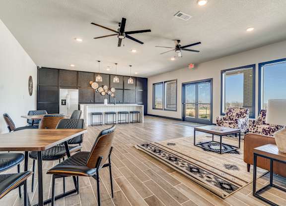 A modern living room with a dining table and chairs.