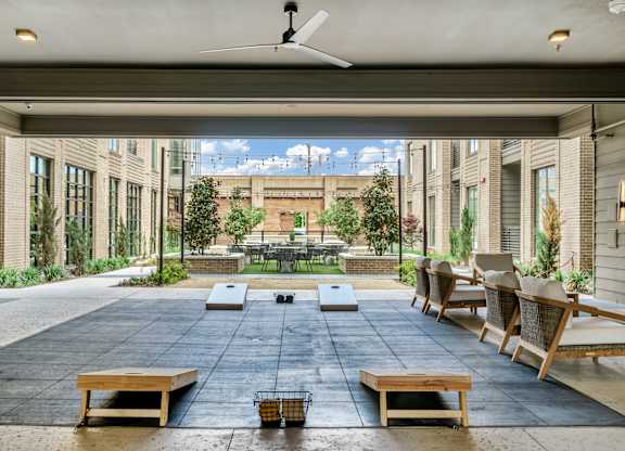 A patio with a table and chairs is shown.