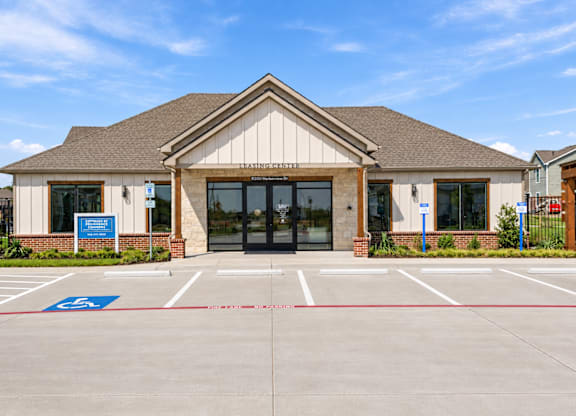 A building with a parking lot in front of it.
