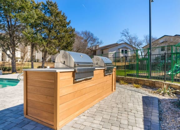 the backyard has a pool and a wooden bar with two hot tubs