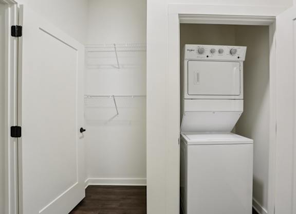 A white oven and dishwasher in a small kitchen.