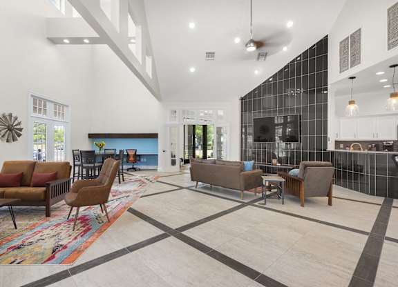 A modern living room with a black and white checkered floor.