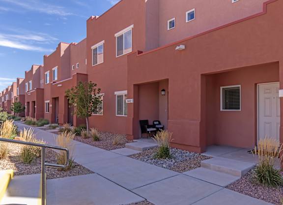 A row of houses with the number 3001 on the front door.