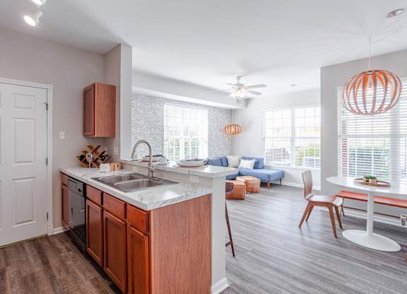 A kitchen with a sink and a counter.