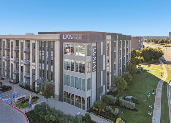 A large building with the name "LUXIA PRESIDEN" on it.