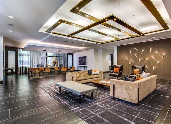 A spacious living room with a large couch and a coffee table.