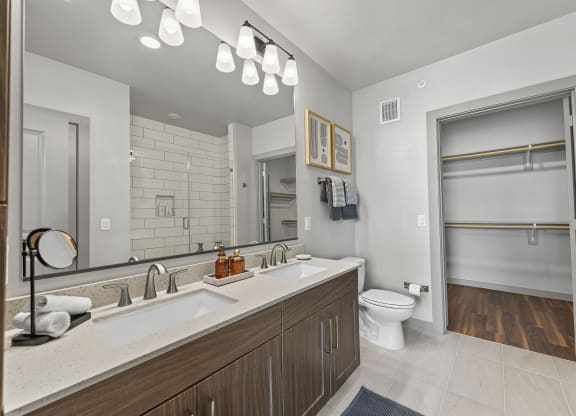 a bathroom with a sink and a toilet and a mirror