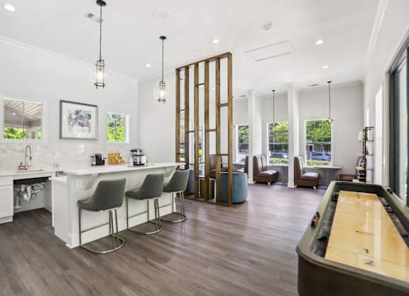 A modern kitchen with a pool table.