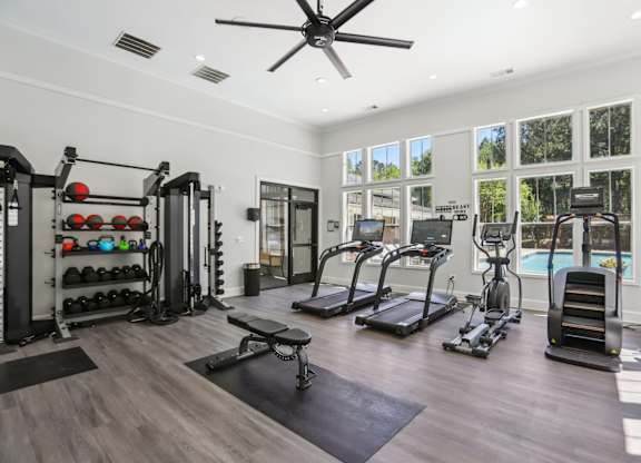 A spacious home gym with a variety of exercise equipment.