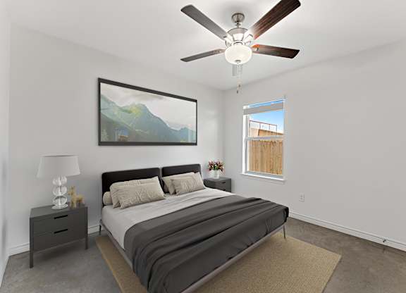 A bedroom with a bed, nightstand, and a painting on the wall.