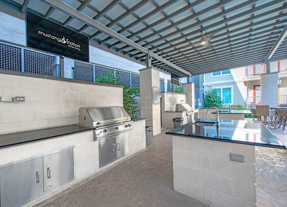 Outdoor kitchen with grill and sink
