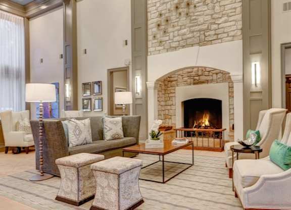 A living room with a fireplace and a couch.