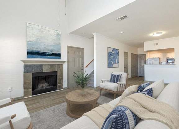 a living room with a fireplace and a couch