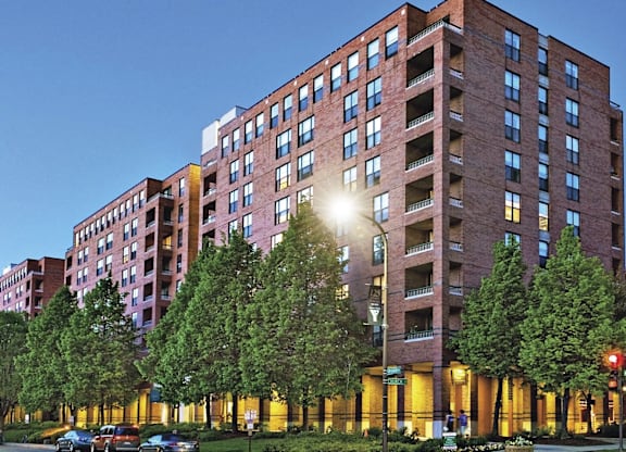 A full building shot of Evanston Place Apartments with trees in the front.