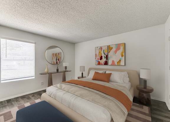 a bedroom with a bed with an orange and white comforter