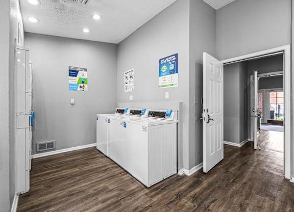 a laundry room with a washer and dryer    and a door