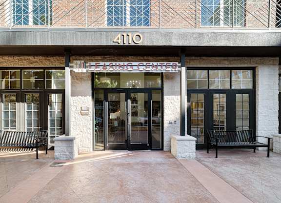the front of a building with two doors and a sign that reads 410