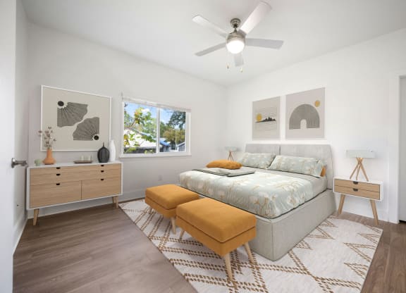 a bedroom with a bed and a ceiling fan