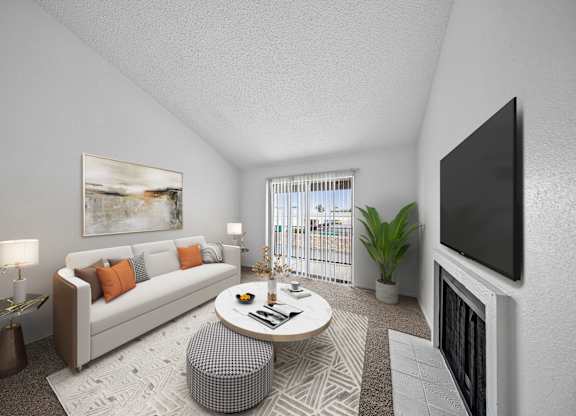 A modern living room with a white couch, a coffee table, and a flat-screen TV mounted on the wall.